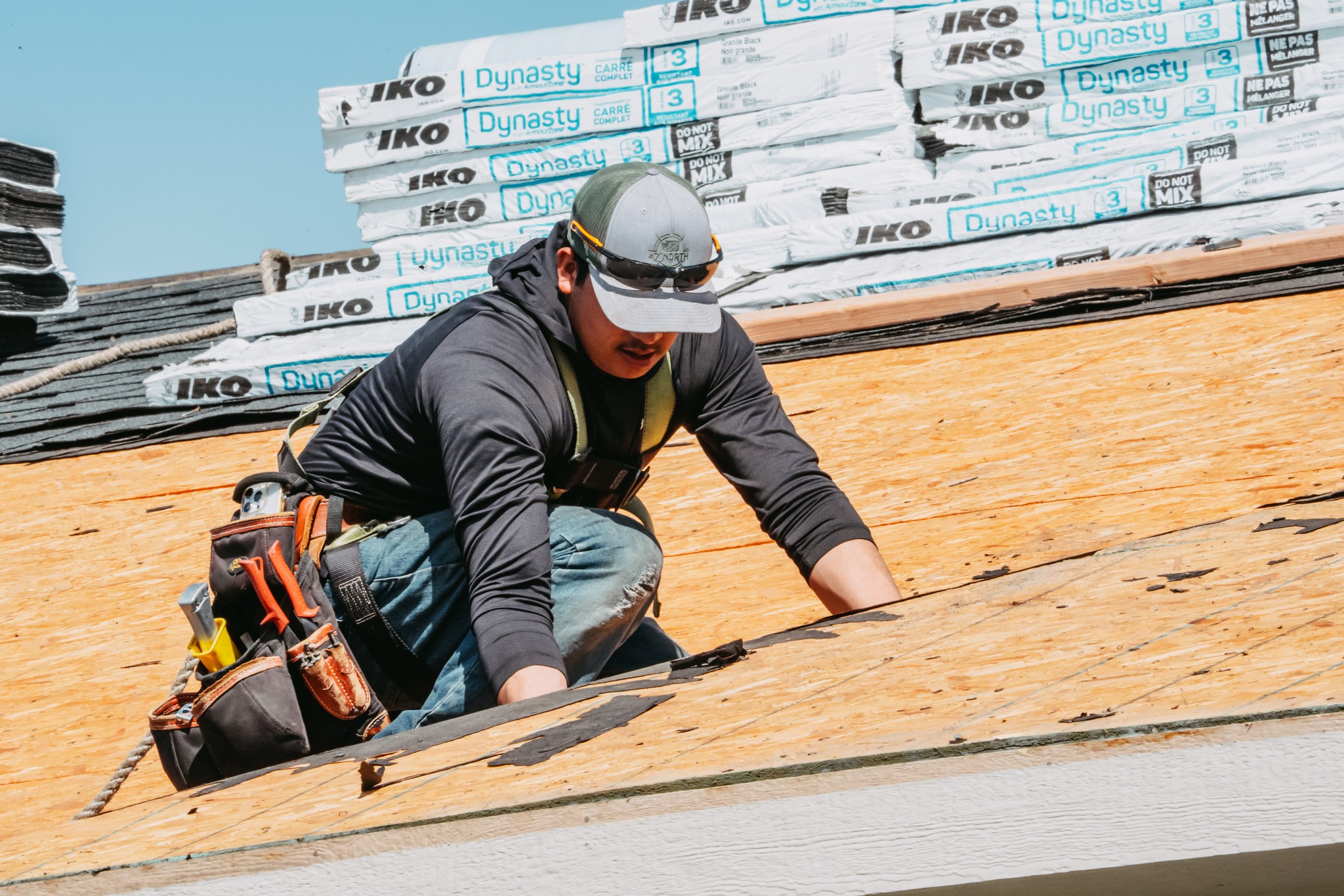 A&A Roofing crew member installing roof decking on a Tri-Cities home