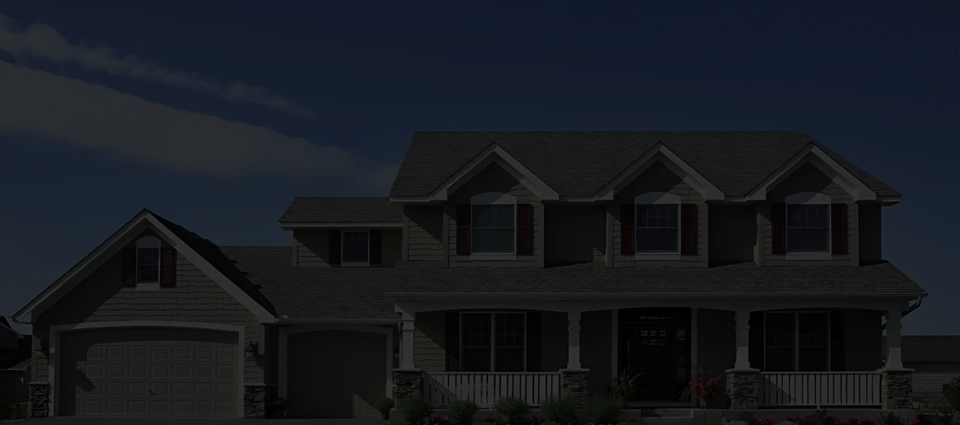 Two-story home with new roof at dusk